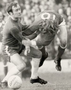 Chopper Harris shakes hands with Stan Bowles after the game